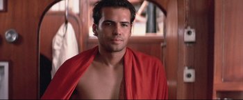 Movie still from “Dead Calm” (1989), directed by Phillip Noyce – A person wearing a red robe; Close Up shot, Low angle