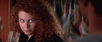 Movie still from “Dead Calm” (1989), directed by Phillip Noyce – A person with curly red hair; Close Up shot, Over the shoulder angle