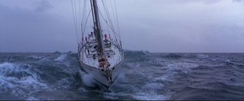 Movie still from “Dead Calm” (1989), directed by Phillip Noyce – A white sailboat in the middle of the ocean; Extreme Wide shot, High angle
