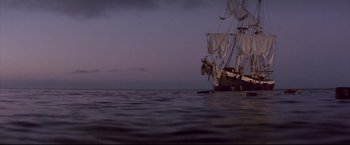 Movie still from “Dead Calm” (1989), directed by Phillip Noyce – A pirate ship in the middle of the ocean at night; Extreme Wide shot, Low angle