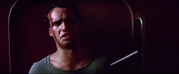 Movie still from “Dead Calm” (1989), directed by Phillip Noyce – A person with blood on his face; Close Up shot, Low angle