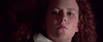 Movie still from “Dead Calm” (1989), directed by Phillip Noyce – A person with a white shirt; Close Up shot, Low angle