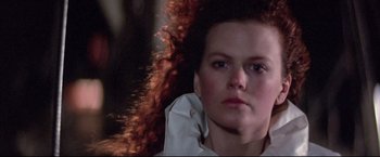 Movie still from “Dead Calm” (1989), directed by Phillip Noyce – A person with long hair; Close Up shot, Low angle