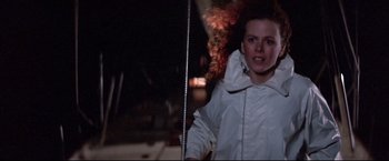 Movie still from “Dead Calm” (1989), directed by Phillip Noyce – A young girl in a white jacket is holding a pole; Medium shot, Low angle