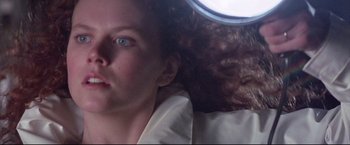 Movie still from “Dead Calm” (1989), directed by Phillip Noyce – A person laying on the ground; Close Up shot, Low angle