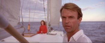 Movie still from “Dead Calm” (1989), directed by Phillip Noyce – A man and a woman sitting on a sailboat in the ocean; Close Up shot, Low angle