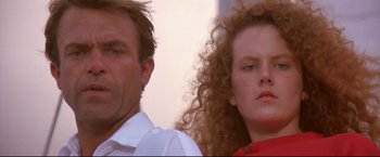 Movie still from “Dead Calm” (1989), directed by Phillip Noyce – A man and a woman standing next to each other; Close Up shot, Low angle