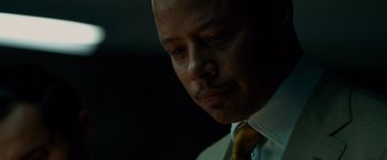 Movie still from “Dead Man Down” (2013), directed by Niels Arden Oplev – A man in a white shirt and a yellow neck tie; Close Up shot, Low angle