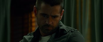 Movie still from “Dead Man Down” (2013), directed by Niels Arden Oplev – A person wearing a shirt and jacket; Close Up shot, Over the shoulder angle