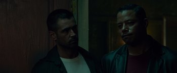 Movie still from “Dead Man Down” (2013), directed by Niels Arden Oplev – Two men standing next to each other in a dark room; Close Up shot, Over the shoulder angle