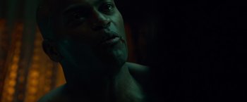 Movie still from “Dead Man Down” (2013), directed by Niels Arden Oplev – A man's face in the dark; Close Up shot, Over the shoulder angle