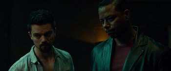 Movie still from “Dead Man Down” (2013), directed by Niels Arden Oplev – Two men standing next to each other in a dark room; Close Up shot, Over the shoulder angle