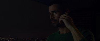 Movie still from “Dead Man Down” (2013), directed by Niels Arden Oplev – A person talking on a cell phone; Close Up shot, Low angle