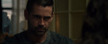 Movie still from “Dead Man Down” (2013), directed by Niels Arden Oplev – A person wearing a sweater looking at the camera; Close Up shot, Over the shoulder angle