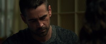 Movie still from “Dead Man Down” (2013), directed by Niels Arden Oplev – A person wearing a sweater; Close Up shot, Over the shoulder angle