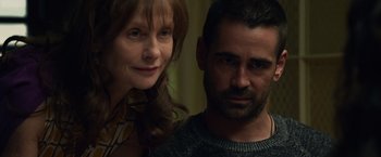 Movie still from “Dead Man Down” (2013), directed by Niels Arden Oplev – A man and a woman pose for a picture; Close Up shot, Over the shoulder angle