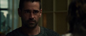 Movie still from “Dead Man Down” (2013), directed by Niels Arden Oplev – A person wearing a sweater; Close Up shot, Over the shoulder angle