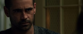 Movie still from “Dead Man Down” (2013), directed by Niels Arden Oplev – A person wearing a sweater; Close Up shot, Over the shoulder angle