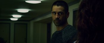 Movie still from “Dead Man Down” (2013), directed by Niels Arden Oplev – A person wearing a sweater; Close Up shot, Over the shoulder angle