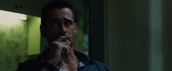 Movie still from “Dead Man Down” (2013), directed by Niels Arden Oplev – A person with a cigarette in his mouth; Close Up shot, Over the shoulder angle