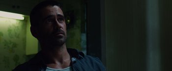 Movie still from “Dead Man Down” (2013), directed by Niels Arden Oplev – A person wearing a jacket; Close Up shot, Low angle