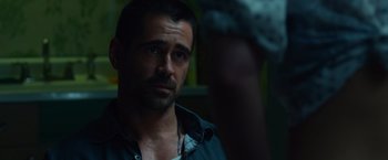 Movie still from “Dead Man Down” (2013), directed by Niels Arden Oplev – A person wearing a shirt; Close Up shot, Over the shoulder angle
