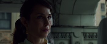 Movie still from “Dead Man Down” (2013), directed by Niels Arden Oplev – A person looking at the camera; Close Up shot, Low angle