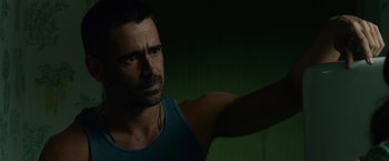 Movie still from “Dead Man Down” (2013), directed by Niels Arden Oplev – A person wearing a tank top; Close Up shot, Over the shoulder angle