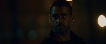 Movie still from “Dead Man Down” (2013), directed by Niels Arden Oplev – A person wearing a black shirt; Close Up shot, Over the shoulder angle