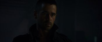 Movie still from “Dead Man Down” (2013), directed by Niels Arden Oplev – A person wearing a jacket; Close Up shot, Over the shoulder angle