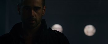 Movie still from “Dead Man Down” (2013), directed by Niels Arden Oplev – A person in a dark room; Close Up shot, Over the shoulder angle
