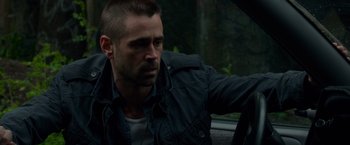 Movie still from “Dead Man Down” (2013), directed by Niels Arden Oplev – A person sitting in a car; Close Up shot, Over the shoulder angle