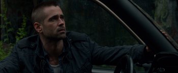 Movie still from “Dead Man Down” (2013), directed by Niels Arden Oplev – A person sitting in a car looking out of the window; Close Up shot, Over the shoulder angle
