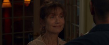 Movie still from “Dead Man Down” (2013), directed by Niels Arden Oplev – A person wearing a brown shirt; Close Up shot, Over the shoulder angle