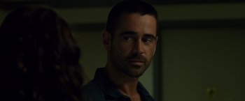Movie still from “Dead Man Down” (2013), directed by Niels Arden Oplev – A person wearing a shirt; Close Up shot, Over the shoulder angle