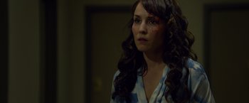 Movie still from “Dead Man Down” (2013), directed by Niels Arden Oplev – A woman with a bruised eye stares into the distance; Close Up shot, Over the shoulder angle