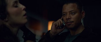 Movie still from “Dead Man Down” (2013), directed by Niels Arden Oplev – A person talking on a cell phone; Close Up shot, Low angle
