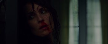 Movie still from “Dead Man Down” (2013), directed by Niels Arden Oplev – A person with blood all over her face; Close Up shot, Low angle