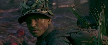 Movie still from “Dead Presidents” (1995), directed by Albert Hughes – A person wearing a hat; Close Up shot, Over the shoulder angle