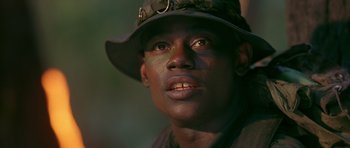 Movie still from “Dead Presidents” (1995), directed by Albert Hughes – A person wearing a hat and looking into the distance; Close Up shot, Low angle
