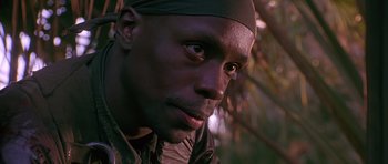 Movie still from “Dead Presidents” (1995), directed by Albert Hughes – A person wearing a head covering; Close Up shot, Low angle