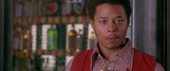 Movie still from “Dead Presidents” (1995), directed by Albert Hughes – A person wearing a red vest; Close Up shot, Low angle