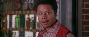 Movie still from “Dead Presidents” (1995), directed by Albert Hughes – A person wearing a red shirt; Close Up shot, High angle