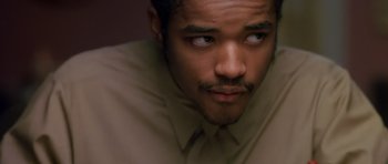 Movie still from “Dead Presidents” (1995), directed by Albert Hughes – A person wearing a shirt and tie; Close Up shot, High angle