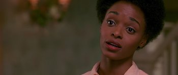 Movie still from “Dead Presidents” (1995), directed by Albert Hughes – A person looking at the camera; Close Up shot, Over the shoulder angle