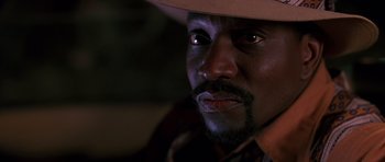 Movie still from “Dead Presidents” (1995), directed by Albert Hughes – A person wearing a cowboy hat; Close Up shot, Low angle