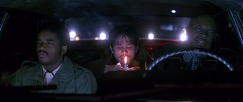 Movie still from “Dead Presidents” (1995), directed by Albert Hughes – A man lighting a candle in the dark; Close Up shot, Low angle