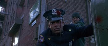 Movie still from “Dead Presidents” (1995), directed by Albert Hughes – A police officer with blood on his face; Close Up shot, Low angle