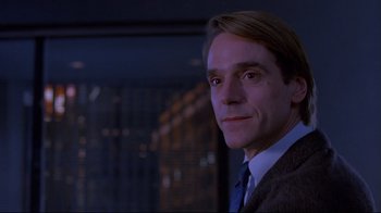 Movie still from “Dead Ringers” (1988), directed by David Cronenberg – A person wearing a suit and tie; Close Up shot, Low angle