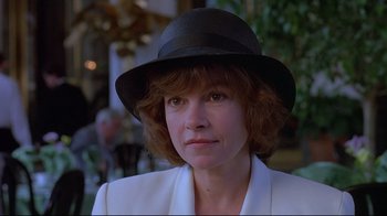 Movie still from “Dead Ringers” (1988), directed by David Cronenberg – A person wearing a hat; Close Up shot, Over the shoulder angle